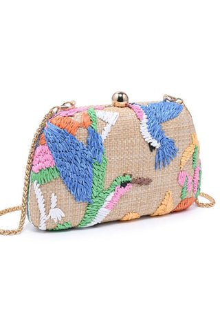 Colorful embroidered handbag with birds on a white background