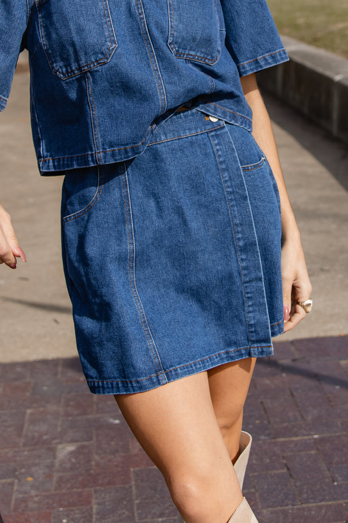 close up of denim skort details showing quality construction and fit