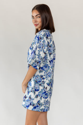 Cuffed half sleeve detail on women's Cala blue floral cotton denim mini dress with relaxed oversized silhouette