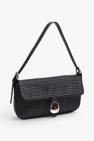 Chocolate textured handbag with a strap on a white background