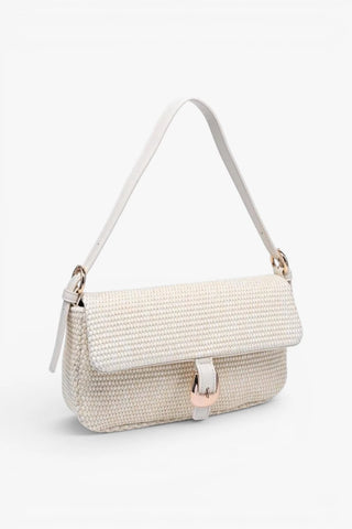 White handbag with straw texture on a white background