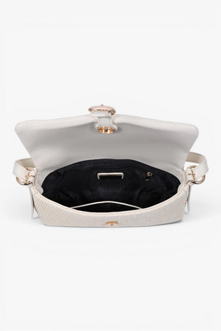 White handbag with gold accents on a white background