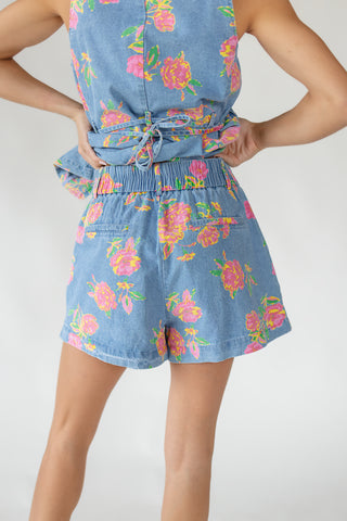 Back view of women's Jardin floral denim shorts showing elastic waistband and faux back pockets in lightweight cotton