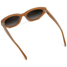 Brown sunglasses with dark lenses on a white background