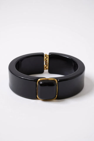Black resin bracelet on a white background