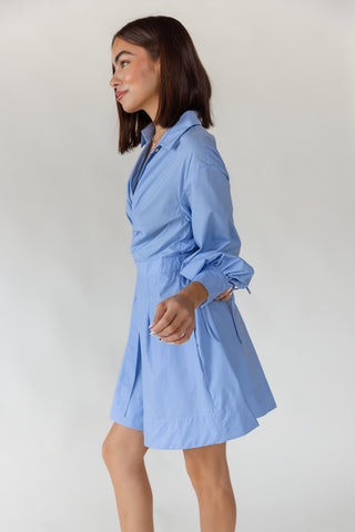 Women's Portofino sky blue long sleeve wrap mini dress styled for transitional dressing in lightweight woven fabric with side pockets