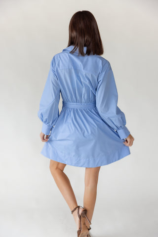 Back view of women's Portofino sky blue wrap mini dress in lightweight 80% polyester 20% cotton woven fabric