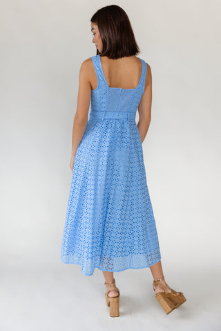 Back view of women's Positano French blue eyelet midi dress showing smocked elastic back panel and back zipper closure