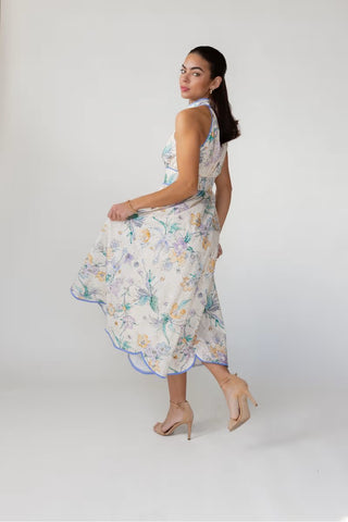 Woman wearing a floral dress on a white background