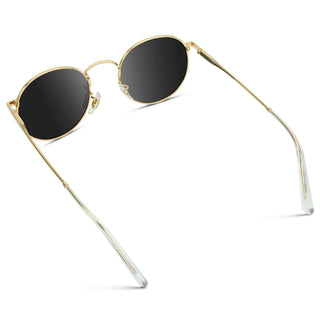 Gold-framed sunglasses with black lenses on a white background