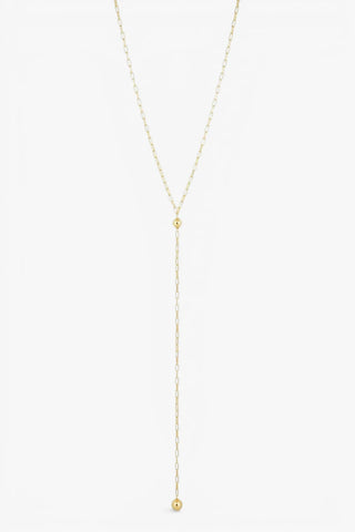 Gold lariat necklace with long drop chain and polished ball pendants in a minimalist silhouette