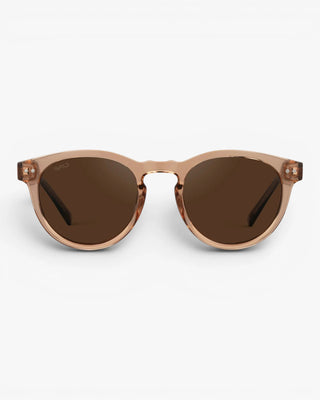 Sunglasses with brown lenses and beige frame on a white background