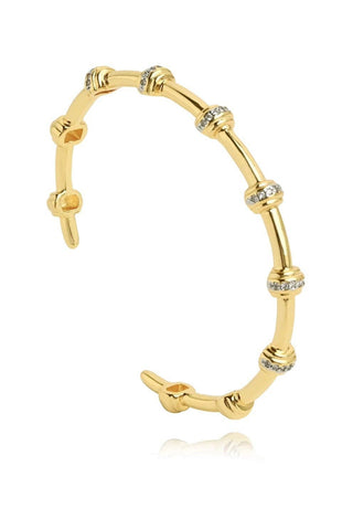 Gold bracelet with diamond accents on a white background