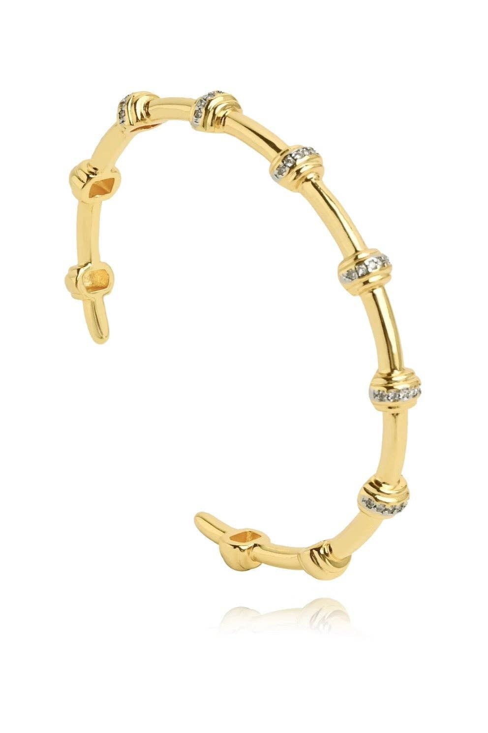 Gold bracelet with diamond accents on a white background