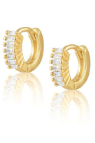 Gold hoop earrings with clear gemstones on a white background