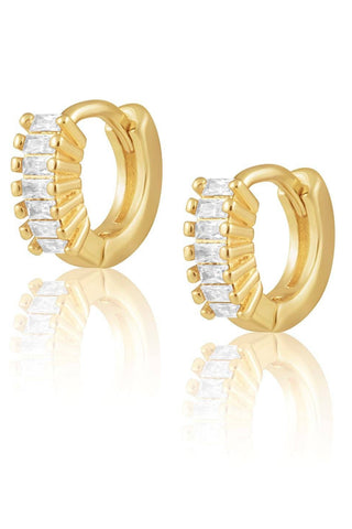 Gold hoop earrings with clear gemstones on a white background