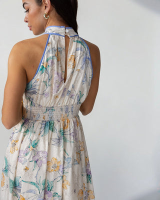JO+CO Calista cream floral midi dress with halter neckline, smocked waist, and contrast blue binding. Cotton.