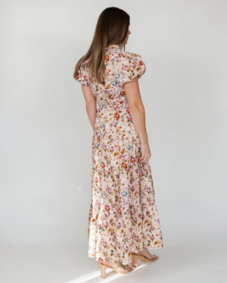 JO+CO Britton Floral Maxi Dress in ecru, featuring a tiered skirt, elasticized waist, and short puff sleeves.