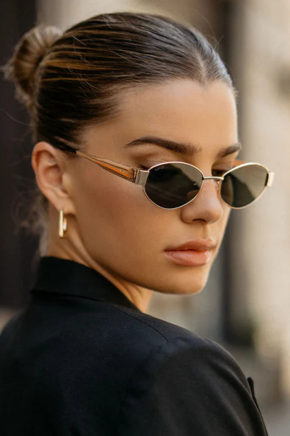 Woman wearing sunglasses with a blurred background